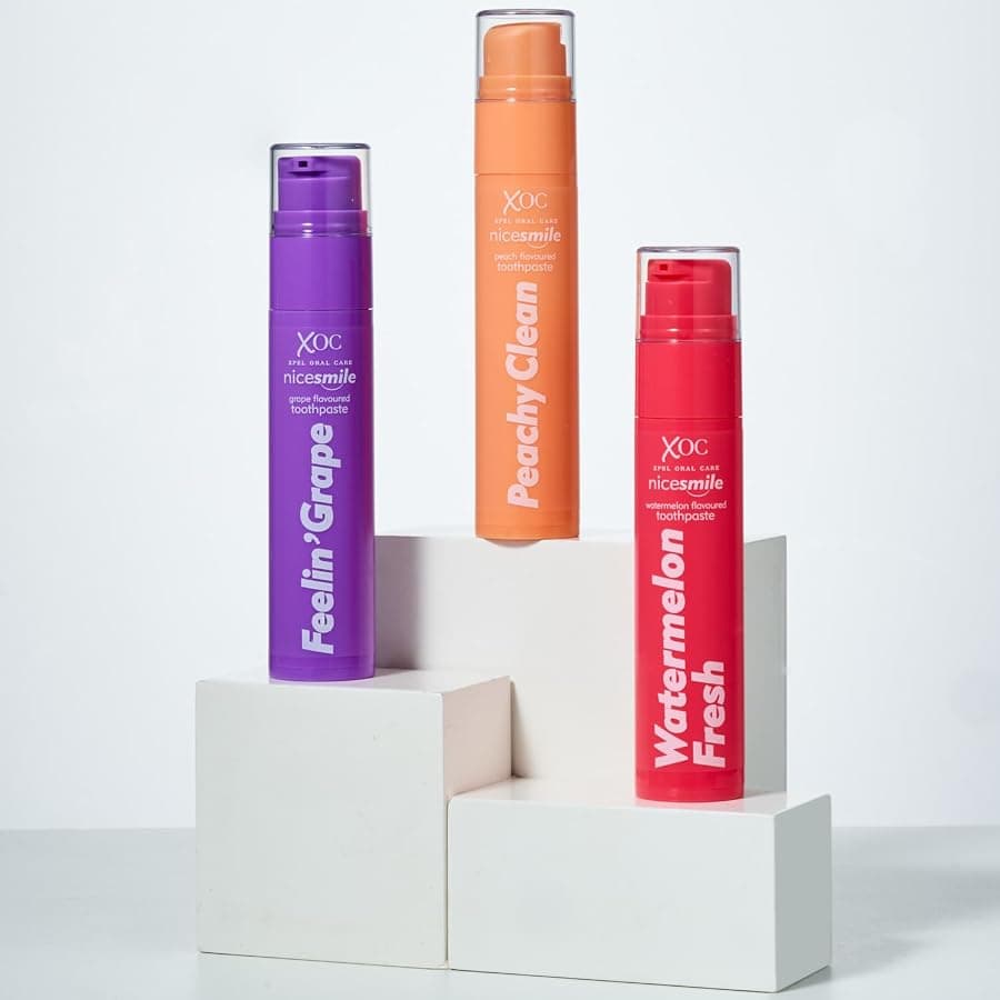 Nice Smile Feelin' Grape, Peachy Clean and Watermelon Fresh tubes standing on white display blocks
